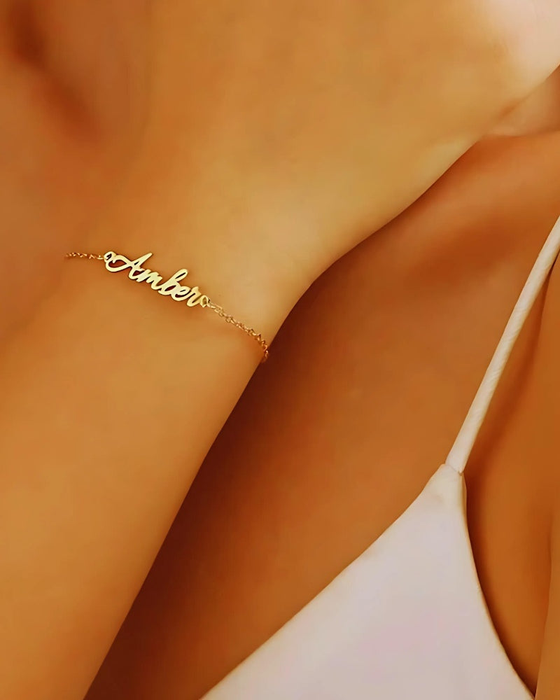 Woman's hand wearing custom Whispering Wish name bracelet